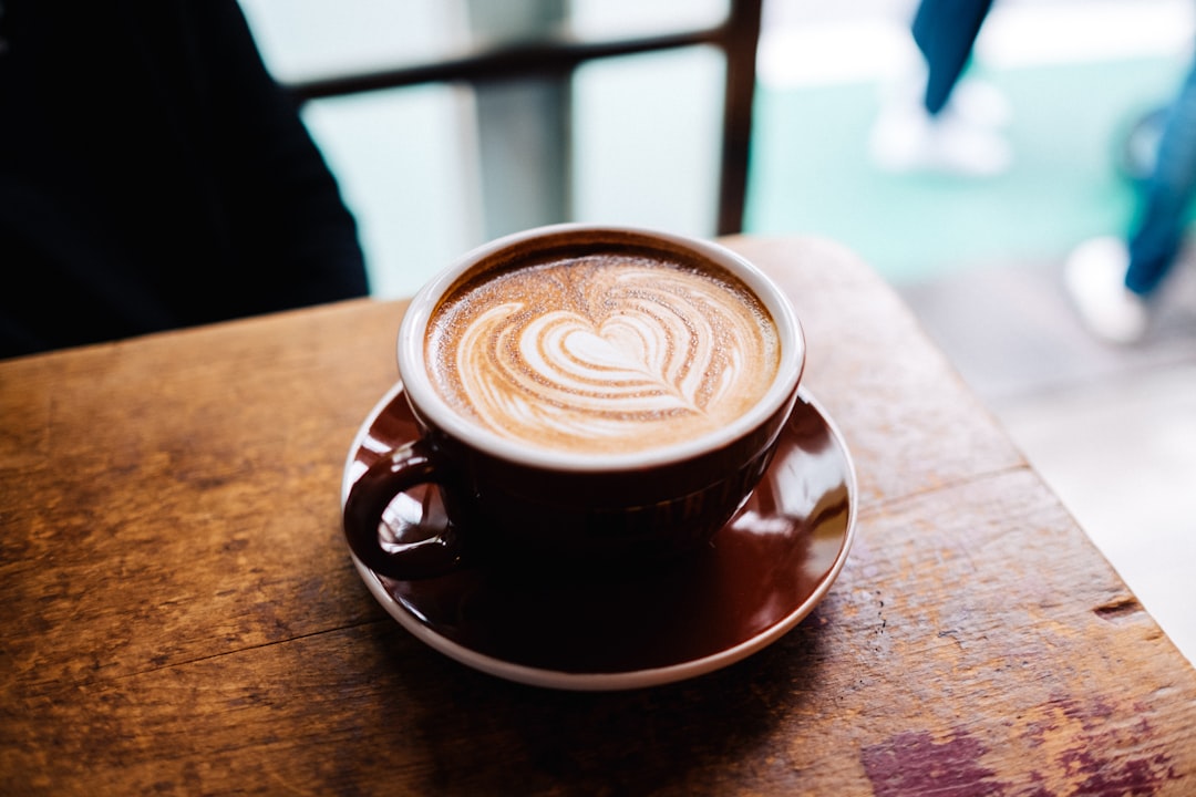 Cup of coffee at a cafe counter - how much does a cup of coffee cost in the UK