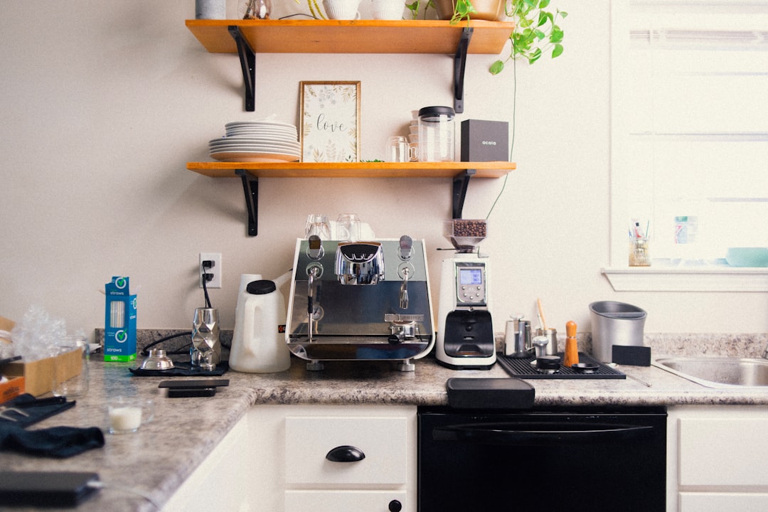 A modern bean-to-cup coffee machine on a kitchen counter