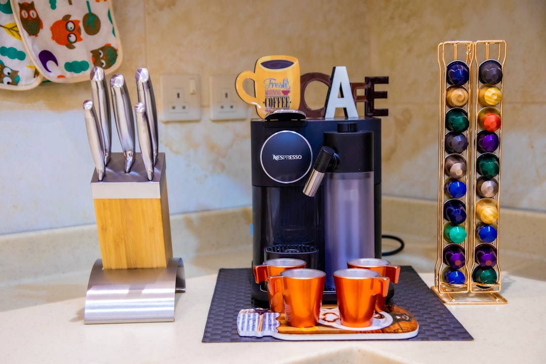 Espresso coffee machine with built-in grinder on kitchen counter