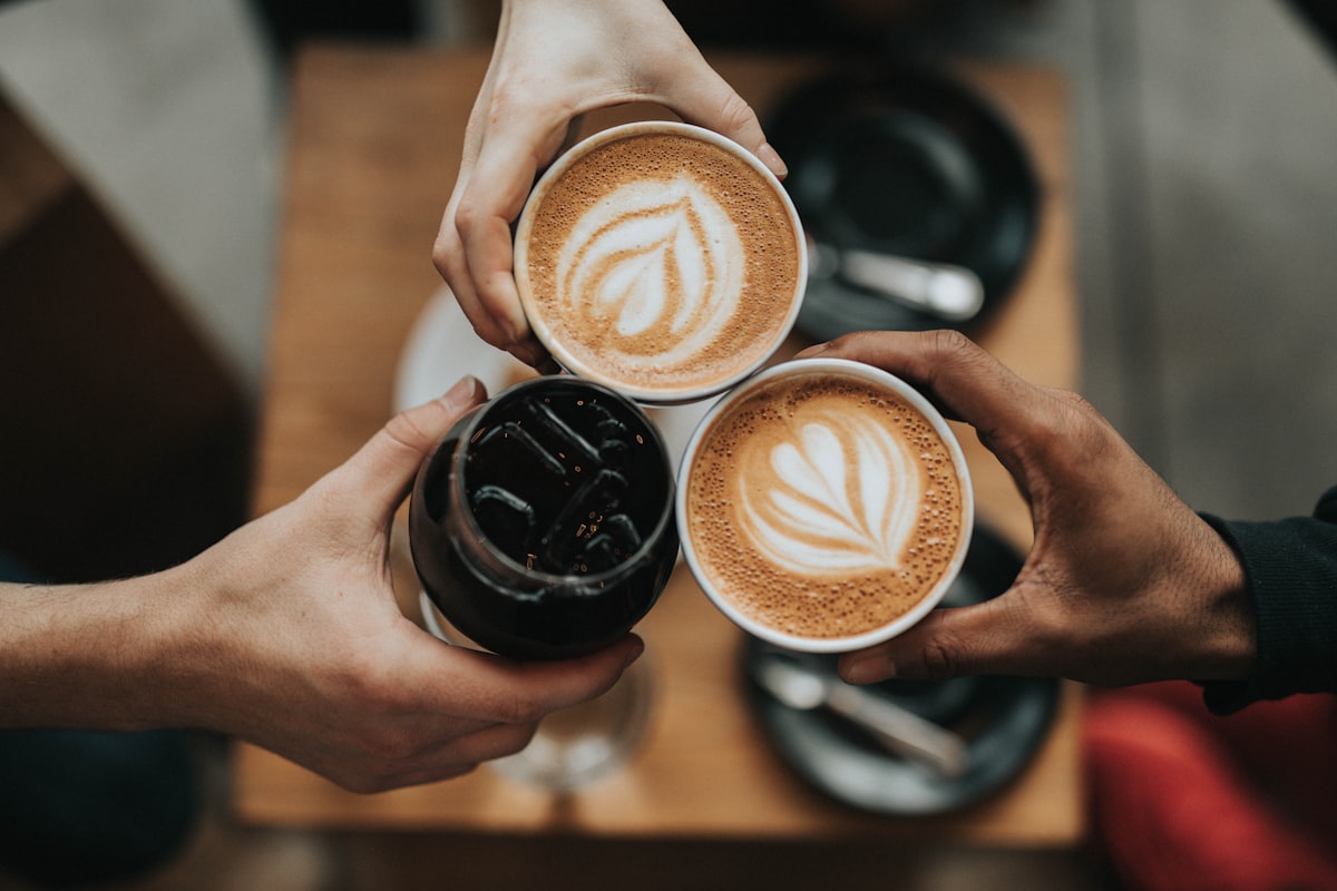 Freshly ground coffee beans in a burr grinder — grind size guide for every brew method