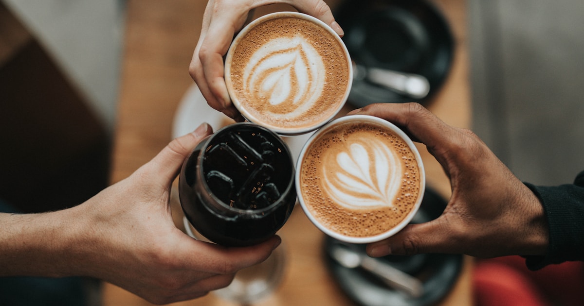 Coffee scale with fresh coffee beans and a pour-over setup on a wooden table