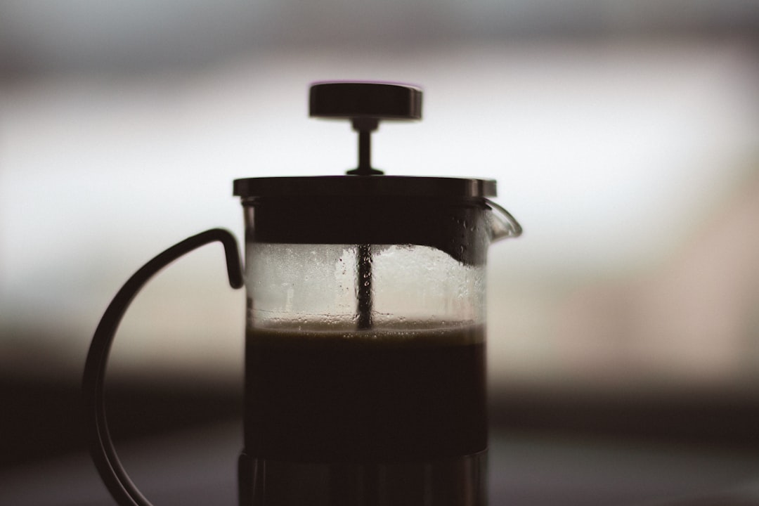 Coffee being steeped in a glass jar as an improvised French press method