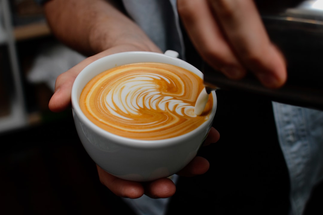 Frothed milk in a glass with latte art